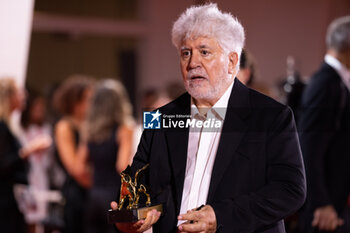 2024-09-07 - Pedro Almodovar poses with the golden Lion Award for The room next door