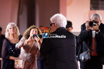 2024-09-07 - Pedro Almodovar poses with the golden Lion Award for The room next door