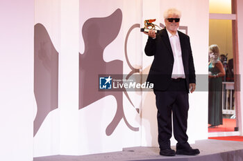 2024-09-07 - Pedro Almodovar poses with the golden Lion Award for The room next door