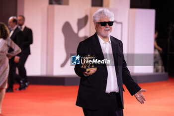 2024-09-07 - Pedro Almodovar poses with the golden Lion Award for The room next door