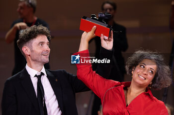 2024-09-07 - Barry Gene Murphy and May Abdalla pose during a photocall after receiving the Venice Immersive Best Experience Award for 'Impulse' during the award ceremony of the 81st Venice Film Festival on September 7, 2024 at Venice Lido. ©Photo: Cinzia Camela. - 2024 WINNERS PHOTOCALL - THE 81ST VENICE INTERNATIONAL FILM FESTIVAL - NEWS - VIP