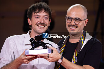 2024-09-07 - Murilo Hauser and Heitor Lorega pose with the Best Screenplay award for 