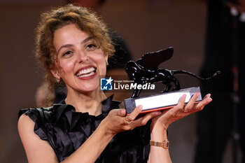 2024-09-07 - Dea Kulumbegashvili poses with the Special Jury Prize for 