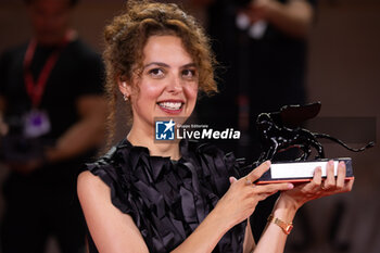 2024-09-07 - Dea Kulumbegashvili poses with the Special Jury Prize for 