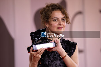 2024-09-07 - Dea Kulumbegashvili poses with the Special Jury Prize for 