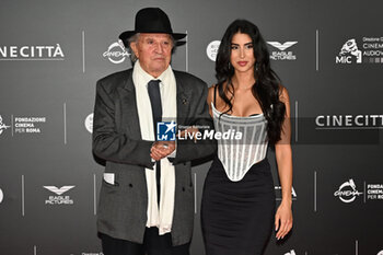 2024-10-14 - Vittorio Storaro and Eleonora Storaro attend the red carpet for the film Megalopolis at Cinecitta Studios on October 14, 2024 in Rome, Italy.

 - RED CARPET MEGALOPOLIS - NEWS - VIP