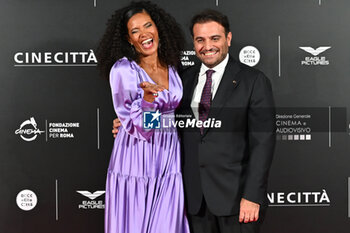 2024-10-14 - Denny Mendez and Gimmi Cangiano attend the red carpet for the film Megalopolis at Cinecitta Studios on October 14, 2024 in Rome, Italy.

 - RED CARPET MEGALOPOLIS - NEWS - VIP