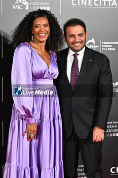 2024-10-14 - Denny Mendez and Gimmi Cangiano attend the red carpet for the film Megalopolis at Cinecitta Studios on October 14, 2024 in Rome, Italy.

 - RED CARPET MEGALOPOLIS - NEWS - VIP