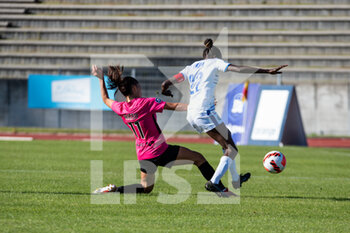 2014-01-18 - Clara Mateo of Paris FC and Siga Tandia of ASJ Soyaux fight for the ball during the Women's French championship, D1 Arkema football match between Paris FC and ASJ Soyaux Charente on October 16, 2021 at Robert Bobin stadium in Bondoufle, France - PARIS FC VS ASJ SOYAUX CHARENTE - FRENCH WOMEN DIVISION 1 - SOCCER