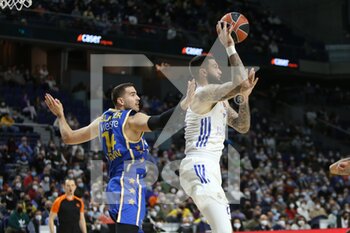 2021-12-02 - Vincent Poirier of Real Madrid and Oz Blayzer of Maccabi Playtika Tel Aviv during the Turkish Airlines Euroleague basketball match between Real Madrid and Maccabi Playtika Tel Aviv on December 2, 2021 at Wizink Center in Madrid, Spain - REAL MADRID VS MACCABI PLAYTIKA TEL AVIV - EUROLEAGUE - BASKETBALL