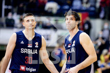 2021-11-28 - Milos TEODOSIC (4) of Serbia and Aleksa AVRAMOVIC (30) of Serbia during the FIBA Basketball World Cup 2023, European Qualifiers, 1st round Group A Basketball match between Belgium and Serbia on November 28, 2021 at the Mons Arena in Mons, Belgium - FIBA BASKETBALL WORLD CUP 2023, EUROPEAN QUALIFIERS, 1ST ROUND GROUP A - BELGIUM VS SERBIA - INTERNATIONALS - BASKETBALL