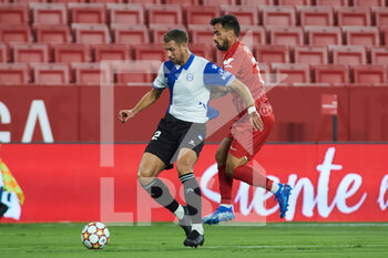 2021-09-09 - Alberto Rodriguez "Tachi" of Alaves and Jesus Joaquin Fernandez "Suso" of Sevilla in action during the football friendly match played between Sevilla Futbol Club and Deportivo Alaves Madrid at Ramon Sanchez-Pizjuan Stadium on September 9, 2021 in Sevilla, Spain - SEVILLA FUTBOL CLUB VS DEPORTIVO ALAVES MADRID AT RAMON SANCHEZ-PIZJUAN STADIUM - FRIENDLY MATCH - SOCCER