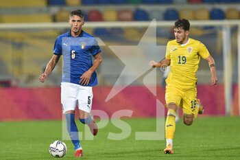2021-11-16 - FROSINONE, ITALY - November 16 : Canestrelli Simone   ( L) of  Italy competes for the ball  Stoica Ianus  (R) of Romania  during   Friendly Match soccer match between  Italy and Romania Benito Stirpe on November 16,2021 in Frosinone Italy - UNDER 21 TEST MATCH 2021 - ITALY VS ROMANIA - FRIENDLY MATCH - SOCCER
