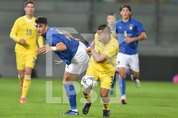 2021-11-16 - FROSINONE, ITALY - November 16 :  Cancellieri Matteo ( L) of  Italy competes for the ball Ticu Costantin Valentin (R) of Romania  during   Friendly Match soccer match between  Italy and Romania Benito Stirpe on November 16,2021 in Frosinone Italy - UNDER 21 TEST MATCH 2021 - ITALY VS ROMANIA - FRIENDLY MATCH - SOCCER