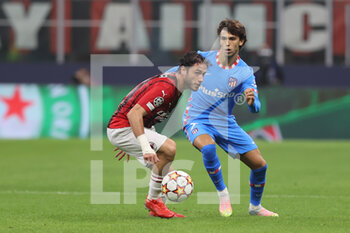 2021-09-28 - Davide Calabria of AC Milan fights for the ball against Joao Felix of Club Atletico de Madrid during the UEFA Champions League 2021/22 Group Stage - Group B football match between AC Milan and Club Atletico de Madrid at Giuseppe Meazza Stadium, Milan, Italy on September 28, 2021 - AC MILAN VS ATLETICO MADRID - UEFA CHAMPIONS LEAGUE - SOCCER