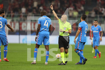 2021-09-28 - Geoffrey Kondogbia of Club Atletico de Madrid yellow card during the UEFA Champions League 2021/22 Group Stage - Group B football match between AC Milan and Club Atletico de Madrid at Giuseppe Meazza Stadium, Milan, Italy on September 28, 2021 - AC MILAN VS ATLETICO MADRID - UEFA CHAMPIONS LEAGUE - SOCCER
