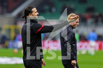 2021-11-03 - Zlatan Ibrahimovic of AC Milan warms up during the UEFA Champions League 2021/22 Group Stage - Group B football match between AC Milan and FC Porto at Giuseppe Meazza Stadium, Milan, Italy on November 03, 2021 - AC MILAN VS FC PORTO - UEFA CHAMPIONS LEAGUE - SOCCER
