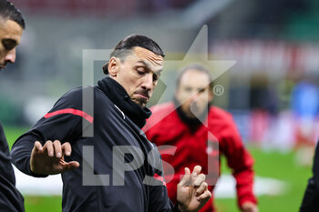 2021-11-03 - Zlatan Ibrahimovic of AC Milan warms up during the UEFA Champions League 2021/22 Group Stage - Group B football match between AC Milan and FC Porto at Giuseppe Meazza Stadium, Milan, Italy on November 03, 2021 - AC MILAN VS FC PORTO - UEFA CHAMPIONS LEAGUE - SOCCER