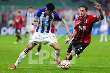 2021-11-03 - Luis Diaz of FC Porto fights for the ball against Davide Calabria of AC Milan during the UEFA Champions League 2021/22 Group Stage - Group B football match between AC Milan and FC Porto at Giuseppe Meazza Stadium, Milan, Italy on November 03, 2021 - AC MILAN VS FC PORTO - UEFA CHAMPIONS LEAGUE - SOCCER