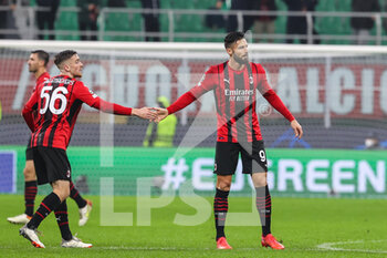 2021-11-03 - Olivier Giroud of AC Milan and Alexis Saelemaekers of AC Milan during the UEFA Champions League 2021/22 Group Stage - Group B football match between AC Milan and FC Porto at Giuseppe Meazza Stadium, Milan, Italy on November 03, 2021 - AC MILAN VS FC PORTO - UEFA CHAMPIONS LEAGUE - SOCCER