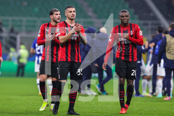 2021-11-03 - Rade Krunic of AC Milan and Pierre Kalulu of AC Milan at the end of the match during the UEFA Champions League 2021/22 Group Stage - Group B football match between AC Milan and FC Porto at Giuseppe Meazza Stadium, Milan, Italy on November 03, 2021 - AC MILAN VS FC PORTO - UEFA CHAMPIONS LEAGUE - SOCCER