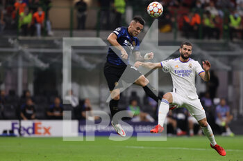 2021-09-15 - Lautaro Martinez of FC Internazionale in action with Daniel Carvajal of Real Madrid CF during the UEFA Champions League 2021/22 Group Stage - Group D football match between FC Internazionale and Real Madrid CF at Giuseppe Meazza Stadium, Milan, Italy on September 15, 2021 - GROUP D - INTER - FC INTERNAZIONALE VS REAL MADRID - UEFA CHAMPIONS LEAGUE - SOCCER