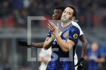 2021-11-24 - Hakan Calhanoglu of FC Internazionale reacts during the UEFA Champions League 2021/22 Group Stage - Group D football match between FC Internazionale and FC Shakhtar Donetsk at Giuseppe Meazza Stadium, Milan, Italy on November 24, 2021 - INTER - FC INTERNAZIONALE VS SHAKHTAR DONETSK - UEFA CHAMPIONS LEAGUE - SOCCER