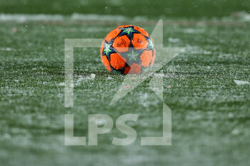 2021-12-08 - The official orange winter Adidas match ball on the pitch in the snow - ATALANTA BC VS VILLARREAL - UEFA CHAMPIONS LEAGUE - SOCCER