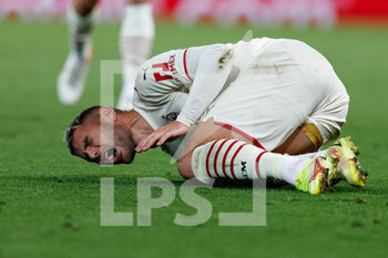 2021-09-15 - Theo Hernandez (AC Milan) hurting on the ground - GROUP B - LIVERPOOL FC VS AC MILAN - UEFA CHAMPIONS LEAGUE - SOCCER