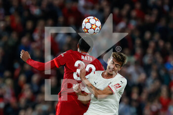 2021-09-15 - Joel Matip (Liverpool FC) header over Daniel Maldini (AC Milan) - GROUP B - LIVERPOOL FC VS AC MILAN - UEFA CHAMPIONS LEAGUE - SOCCER
