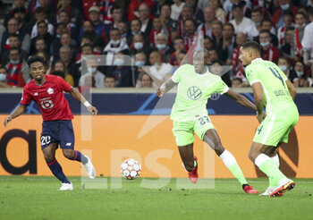 2021-09-14 - Josuha Guilavogui of Wolfsburg, Angel Gomes of Lille (left) during the UEFA Champions League, Group Stage, Group G football match between Lille OSC (LOSC) and VfL Wolfsburg on September 14, 2021 at Stade Pierre Mauroy in Villeneuve-d?Ascq near Lille, France - LILLE OSC (LOSC) AND VEREIN FUR LEIBESUBUNGEN WOLFSBURG - UEFA CHAMPIONS LEAGUE - SOCCER
