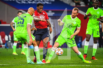 2021-09-14 - Jonathan DAVID of Lille and Maximilian ARNOLD of Wolfsburg during the UEFA Champions League, Group Stage, Group G football match between Lille OSC (LOSC) and Verein fur Leibesubungen Wolfsburg on September 14, 2021 at Pierre Mauroy Stadium in Villeneuve-d'Ascq, France - LILLE OSC (LOSC) AND VEREIN FUR LEIBESUBUNGEN WOLFSBURG - UEFA CHAMPIONS LEAGUE - SOCCER