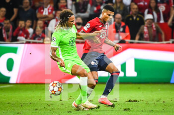 2021-09-14 - Kevin MBABU of Wolfsburg and REINILDO of Lille during the UEFA Champions League, Group Stage, Group G football match between Lille OSC (LOSC) and Verein fur Leibesubungen Wolfsburg on September 14, 2021 at Pierre Mauroy Stadium in Villeneuve-d'Ascq, France - LILLE OSC (LOSC) AND VEREIN FUR LEIBESUBUNGEN WOLFSBURG - UEFA CHAMPIONS LEAGUE - SOCCER