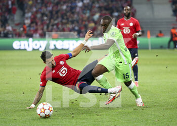 2021-09-14 - Jerome Roussillon of Wolfsburg, Jose Fonte of Lille (left) during the UEFA Champions League, Group Stage, Group G football match between Lille OSC (LOSC) and VfL Wolfsburg on September 14, 2021 at Stade Pierre Mauroy in Villeneuve-d?Ascq near Lille, France - LILLE OSC (LOSC) AND VEREIN FUR LEIBESUBUNGEN WOLFSBURG - UEFA CHAMPIONS LEAGUE - SOCCER