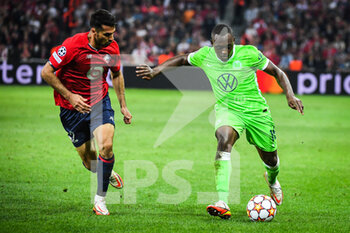 2021-09-14 - Zeki CELIK of Lille and Jerome ROUSSILLON of Wolfsburg during the UEFA Champions League, Group Stage, Group G football match between Lille OSC (LOSC) and Verein fur Leibesubungen Wolfsburg on September 14, 2021 at Pierre Mauroy Stadium in Villeneuve-d'Ascq, France - LILLE OSC (LOSC) AND VEREIN FUR LEIBESUBUNGEN WOLFSBURG - UEFA CHAMPIONS LEAGUE - SOCCER