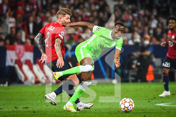 2021-09-14 - XEKA of Lille and Dodi LUKEBAKIO of Wolfsburg during the UEFA Champions League, Group Stage, Group G football match between Lille OSC (LOSC) and Verein fur Leibesubungen Wolfsburg on September 14, 2021 at Pierre Mauroy Stadium in Villeneuve-d'Ascq, France - LILLE OSC (LOSC) AND VEREIN FUR LEIBESUBUNGEN WOLFSBURG - UEFA CHAMPIONS LEAGUE - SOCCER