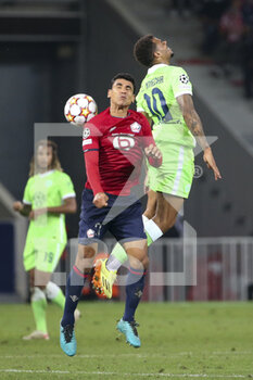 2021-09-14 - Benjamin Andre of Lille, Lukas Nmecha of Wolfsburg during the UEFA Champions League, Group Stage, Group G football match between Lille OSC (LOSC) and VfL Wolfsburg on September 14, 2021 at Stade Pierre Mauroy in Villeneuve-d?Ascq near Lille, France - LILLE OSC (LOSC) AND VEREIN FUR LEIBESUBUNGEN WOLFSBURG - UEFA CHAMPIONS LEAGUE - SOCCER