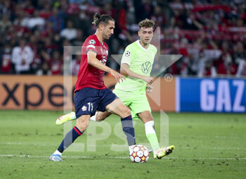 2021-09-14 - Yusuf Yazici of Lille, Luka Waldschmidt of Wolfsburg during the UEFA Champions League, Group Stage, Group G football match between Lille OSC (LOSC) and VfL Wolfsburg on September 14, 2021 at Stade Pierre Mauroy in Villeneuve-d?Ascq near Lille, France - LILLE OSC (LOSC) AND VEREIN FUR LEIBESUBUNGEN WOLFSBURG - UEFA CHAMPIONS LEAGUE - SOCCER