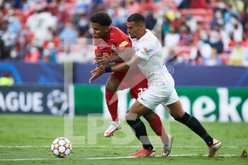 2021-09-14 - Karim Adeyemi of Salzburg and Diego Carlos of Sevilla in action during the UEFA Champions League, Group G, football match played between Sevilla FC and RB Salzburg at Ramon Sanchez-Pizjuan stadium on September 14, 2021, in Sevilla, Spain - GROUP G - SEVILLA FC VS RB SALZBURG - UEFA CHAMPIONS LEAGUE - SOCCER