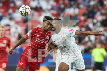 2021-09-14 - Karim Adeyemi of Salzburg and Fernando Reges of Sevilla in action during the UEFA Champions League, Group G, football match played between Sevilla FC and RB Salzburg at Ramon Sanchez-Pizjuan stadium on September 14, 2021, in Sevilla, Spain - GROUP G - SEVILLA FC VS RB SALZBURG - UEFA CHAMPIONS LEAGUE - SOCCER