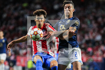 2021-09-15 - Joao Felix of Atletico de Madrid and Mateus Uribe of Porto in action during the UEFA Champions League, Group B, football match played between Atletico de Madrid and FC Porto at Wanda Metropolitano stadium on September 15, 2021, in Madrid, Spain - GROUP B - ATLETICO DE MADRID VS FC PORTO - UEFA CHAMPIONS LEAGUE - SOCCER