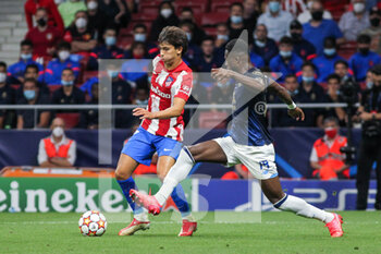 2021-09-15 - Chancel Mbemba of Porto and Joao Felix of Atletico de Madrid in action during the UEFA Champions League, Group B, football match played between Atletico de Madrid and FC Porto at Wanda Metropolitano stadium on September 15, 2021, in Madrid, Spain - GROUP B - ATLETICO DE MADRID VS FC PORTO - UEFA CHAMPIONS LEAGUE - SOCCER