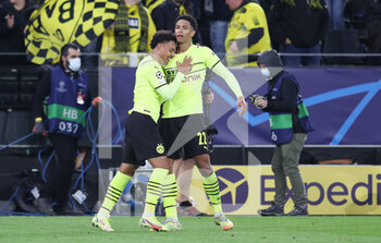 2021-09-28 - Donyell Malen of Borussia Dortmund celebrates his 1-0 goal with Jude Bellingham during the UEFA Champions League, Group C football match between Borussia Dortmund and Sporting CP on September 28, 2021 at Signal Iduna Park in Dortmund, Germany - BORUSSIA DORTMUND VS SPORTING CP - UEFA CHAMPIONS LEAGUE - SOCCER