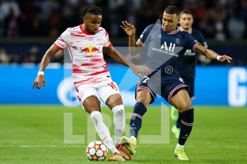 2021-10-19 - Christopher Nkunku of RB Leipzig and Kylian Mbappe of Paris Saint Germain during the UEFA Champions League, Group A football match between Paris Saint-Germain and RB Leipzig on October 19, 2021 at Parc des Princes stadium in Paris, France - PARIS SAINT-GERMAIN VS RB LEIPZIG - UEFA CHAMPIONS LEAGUE - SOCCER