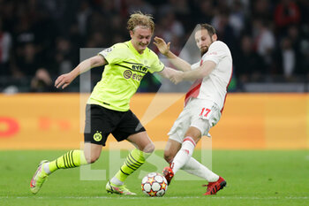 2021-10-19 - Julian Brandt of Borussia Dortmund, Daley Blind of Ajax during the UEFA Champions League, Group C football match between Ajax and Borussia Dortmund on October 19, 2021 at Johan Cruijff ArenA in Amsterdam, Netherlands - AJAX VS BORUSSIA DORTMUND - UEFA CHAMPIONS LEAGUE - SOCCER