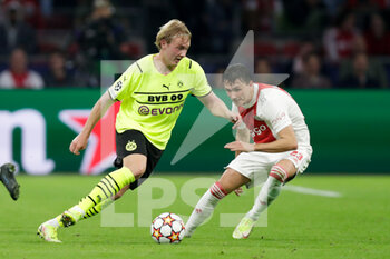 2021-10-19 - Julian Brandt of Borussia Dortmund, Steven Berghuis of Ajax during the UEFA Champions League, Group C football match between Ajax and Borussia Dortmund on October 19, 2021 at Johan Cruijff ArenA in Amsterdam, Netherlands - AJAX VS BORUSSIA DORTMUND - UEFA CHAMPIONS LEAGUE - SOCCER