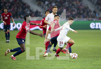 2021-10-20 - Papu Gomez of Sevilla FC, left Jonathan Ikone of Lille, Mehmet Zeki Celik of Lille during the UEFA Champions League, Group G football match between Lille OSC (LOSC) and Sevilla FC on October 20, 2021 at Stade Pierre Mauroy in Villeneuve-d'Ascq near Lille, France - LILLE OSC (LOSC) VS SEVILLA FC - UEFA CHAMPIONS LEAGUE - SOCCER