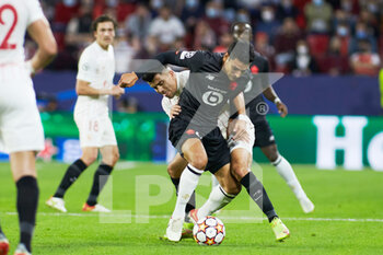 2021-11-02 - Benjamin Andre of Lille OSC and Marcos Acuna of Sevilla during the UEFA Champions League, Group G football match between Sevilla FC and Lille OSC on November 2, 2021 at Ramon Sanchez-Pizjuan stadium in Sevilla, Spain - SEVILLA FC VS LILLE OSC - UEFA CHAMPIONS LEAGUE - SOCCER