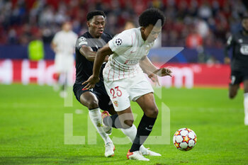 2021-11-02 - Jonathan David of Lille OSC and Jules Kounde of Sevilla during the UEFA Champions League, Group G football match between Sevilla FC and Lille OSC on November 2, 2021 at Ramon Sanchez-Pizjuan stadium in Sevilla, Spain - SEVILLA FC VS LILLE OSC - UEFA CHAMPIONS LEAGUE - SOCCER