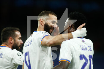 2021-11-03 - Karim Benzema of Real Madrid celebrates a goal with Vinicius Junior during the UEFA Champions League, Group D football match between Real Madrid and Shakhtar Donetsk on November 03, 2021 at Santiago Bernabeu stadium in Madrid, Spain - REAL MADRID VS SHAKHTAR DONETSK - UEFA CHAMPIONS LEAGUE - SOCCER
